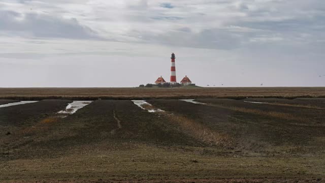 Zeitraffer: Leuchtturm Westerhever im Regen (Westerheversand · Nordseeküste)
